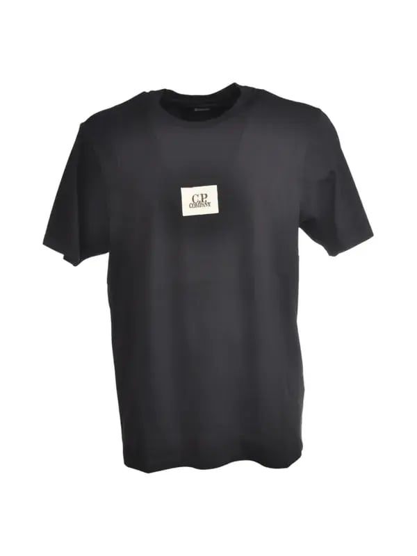 Black t-shirt with logo patch, original still life photo